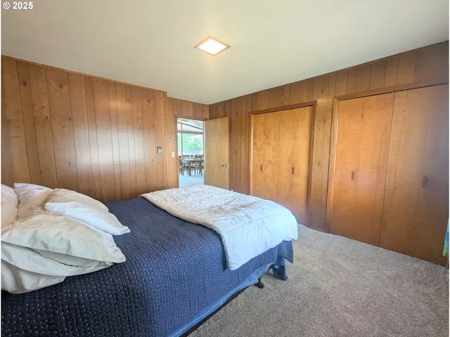 a bedroom with a bed and a closet