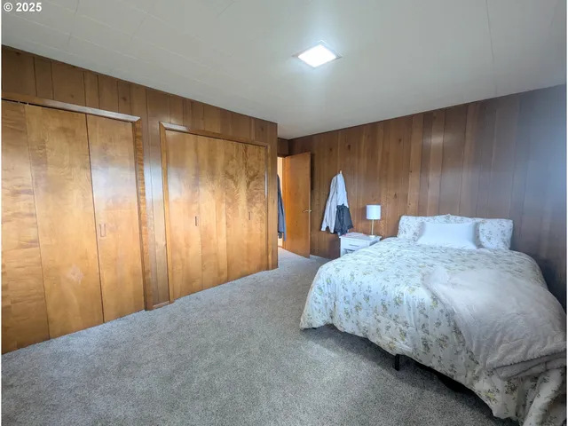 a bedroom with a bed and a table