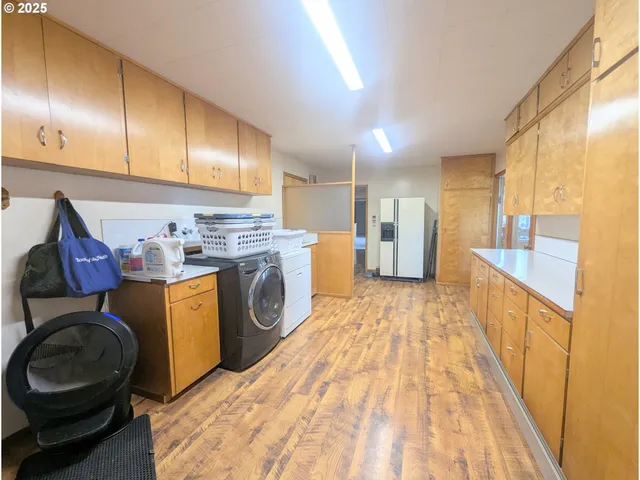 a open kitchen with a sink stove and refrigerator