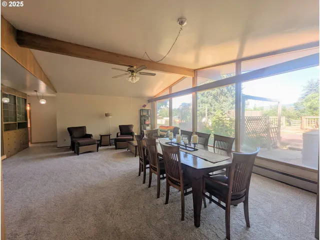a view of a dining room with furniture window and outside view