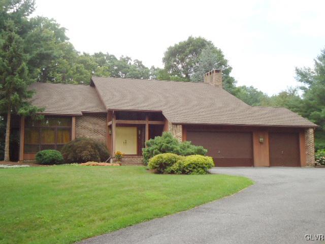 3668 Ritter Road Allentown, PA 18104 - Photo 1 of 36 a front view of a house with a garden and plants