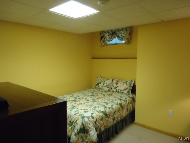 3668 Ritter Road Allentown, PA 18104 - Photo 13 of 36 a bedroom with a bed and paintings on the wall