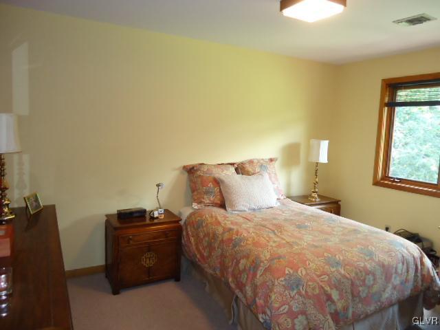 3668 Ritter Road Allentown, PA 18104 - Photo 33 of 36 a bed sitting in a bedroom next to a window