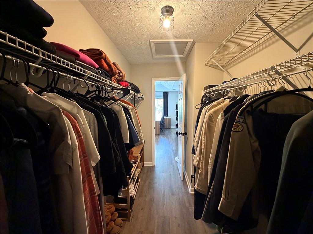 934 Bay Ridge Drive Lawrenceville, GA 30045 - Photo 63 of 78 a view of walk in closet with clothes and shoes