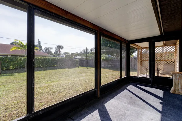 a view of a room with wooden floor and wooden floor