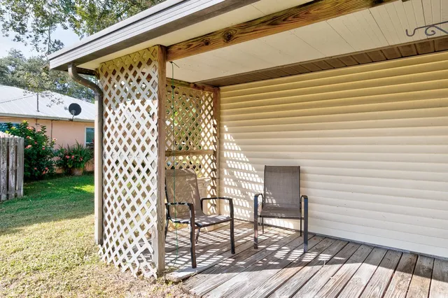 a patio with table and chairs