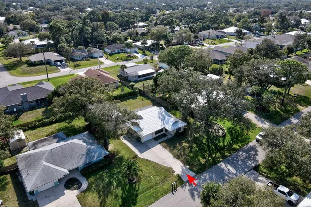 an aerial view of multiple houses with yard