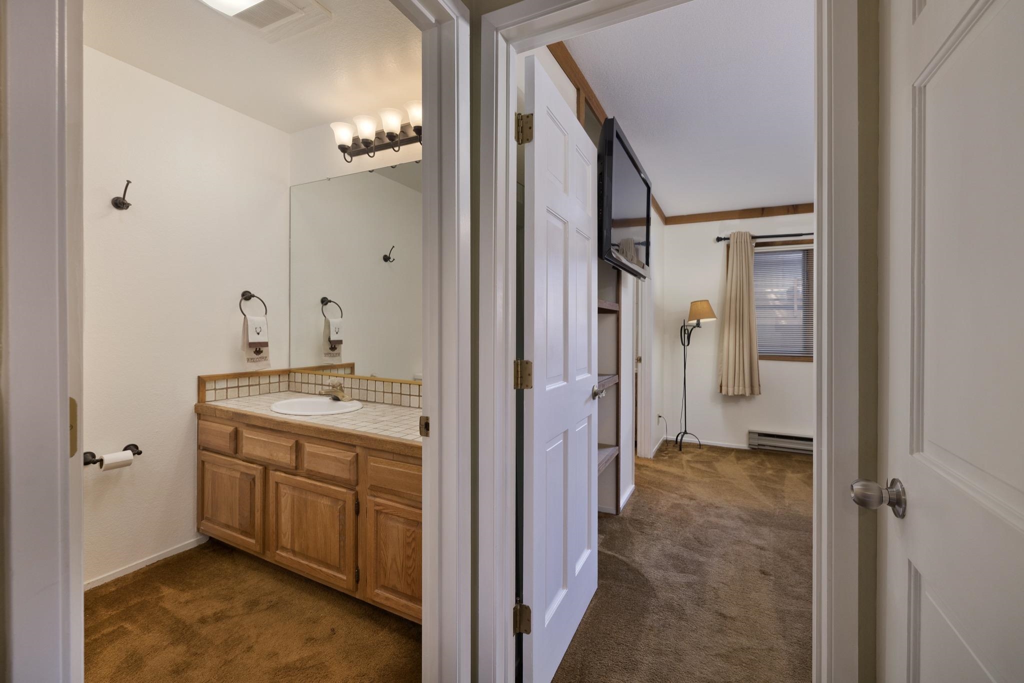 484 Manzanita Road, Unit 16 Mammoth Lakes, CA 93546 - Photo 27 of 34 a bathroom with a sink and a mirror