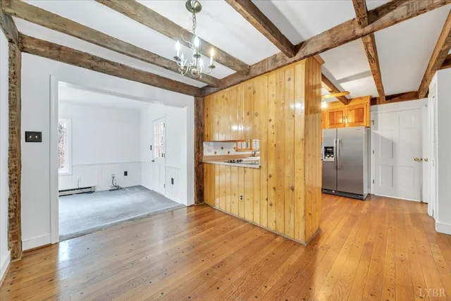 a view of hallway with wooden floor