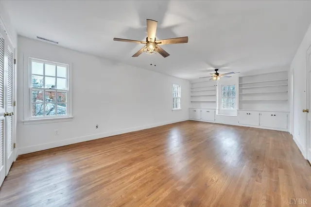 a bathroom with a sink vanity and shower