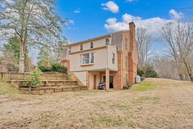 a picture of a bathroom with a white wall