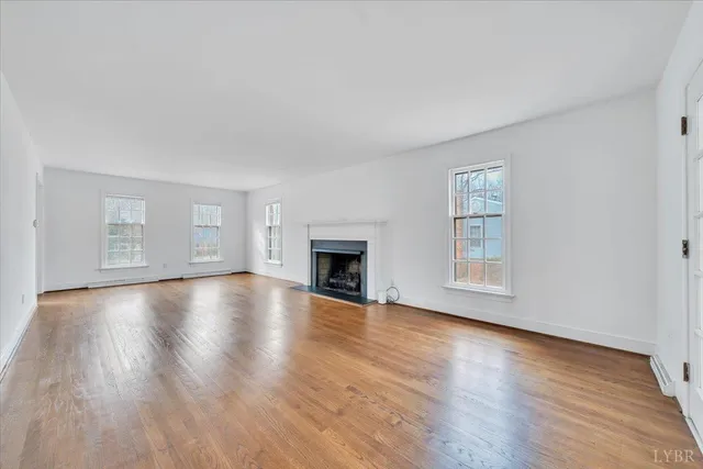 a large kitchen with stainless steel appliances granite countertop a refrigerator and a sink