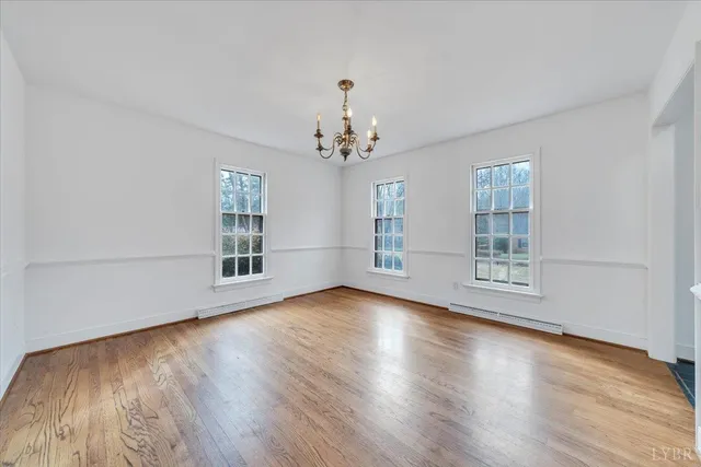 a kitchen with stainless steel appliances sink cabinets and wooden floor