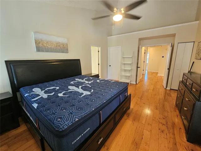 a living room with a couch and wooden floor