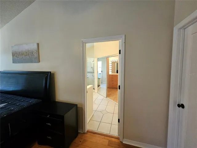 a view of a bedroom from a hallway