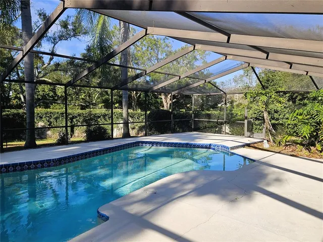 a view of swimming pool with a patio