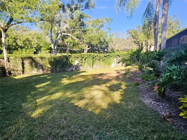 a view of yard with swimming pool