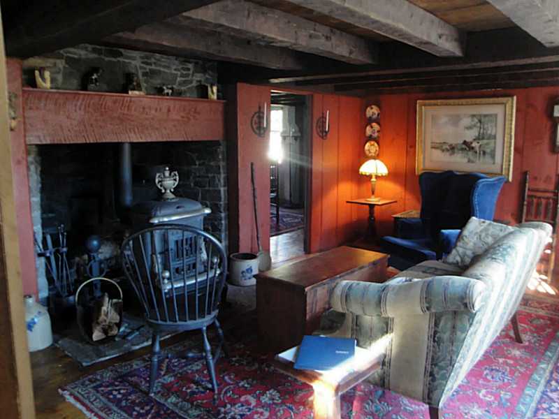 18 Balcom Road Foster, RI 02825 - Photo 11 of 25 Den/Family/Great Room. Stunning wood stove and large hearth warms the whole house and makes this beautiful space unique and grand