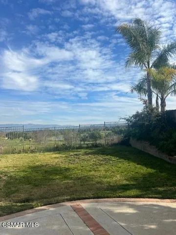 a view of a lake with a big yard