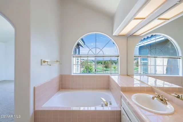 a bathroom with a bathtub and a sink