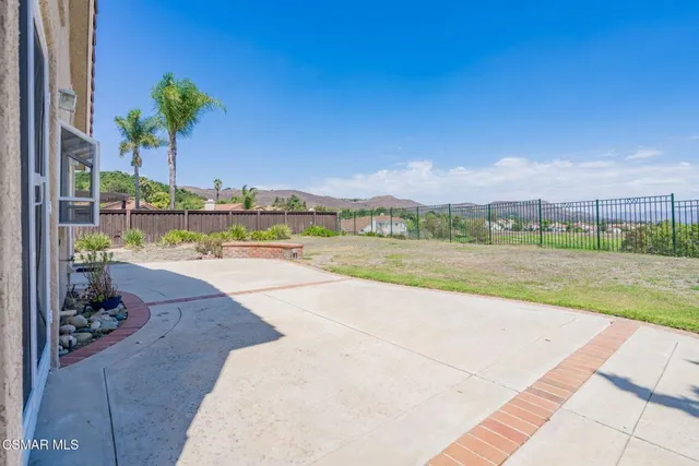 a house with swimming pool in front of it