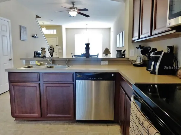 a kitchen with a sink and cabinets
