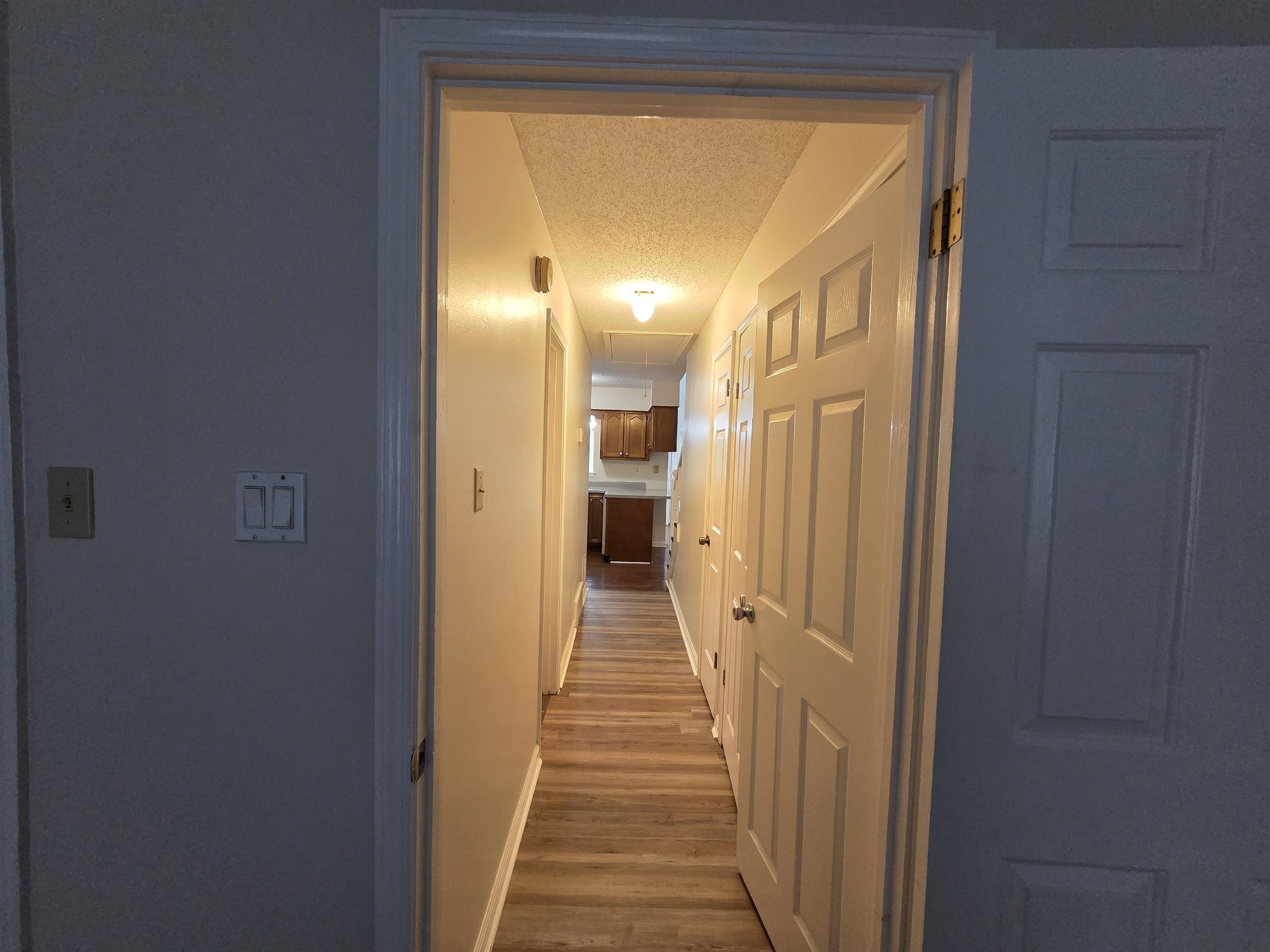 3945 Oak Branch Circle East Memphis, TN 38135 - Photo 13 of 24 a view of a hallway with wooden shelves