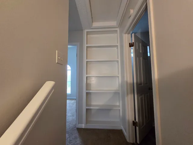 a view of hallway with closet