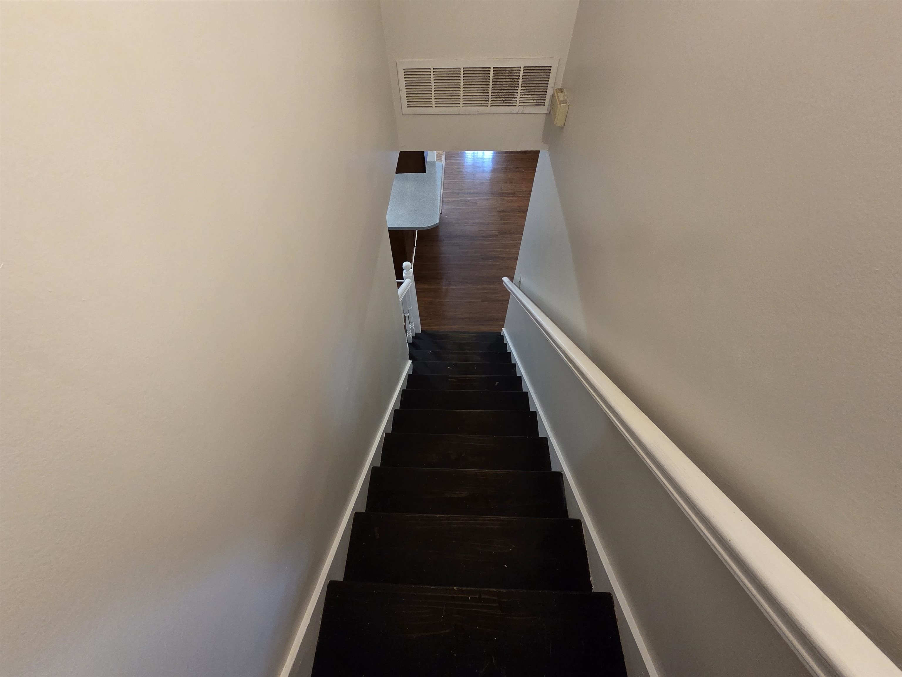3945 Oak Branch Circle East Memphis, TN 38135 - Photo 17 of 24 a view of a hallway with wooden floor and staircase