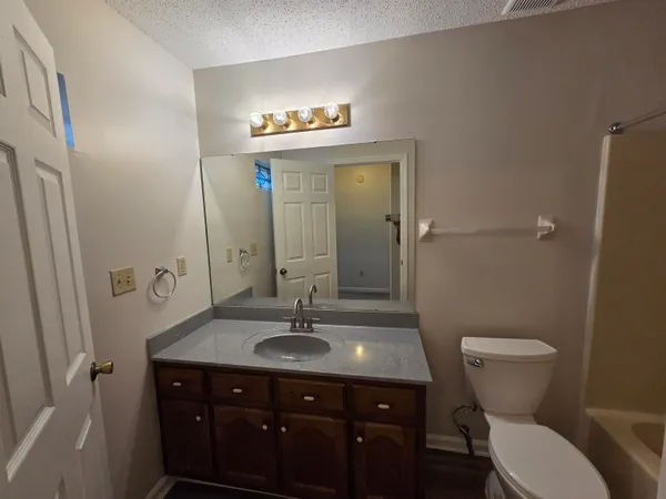 a kitchen with a refrigerator and a sink