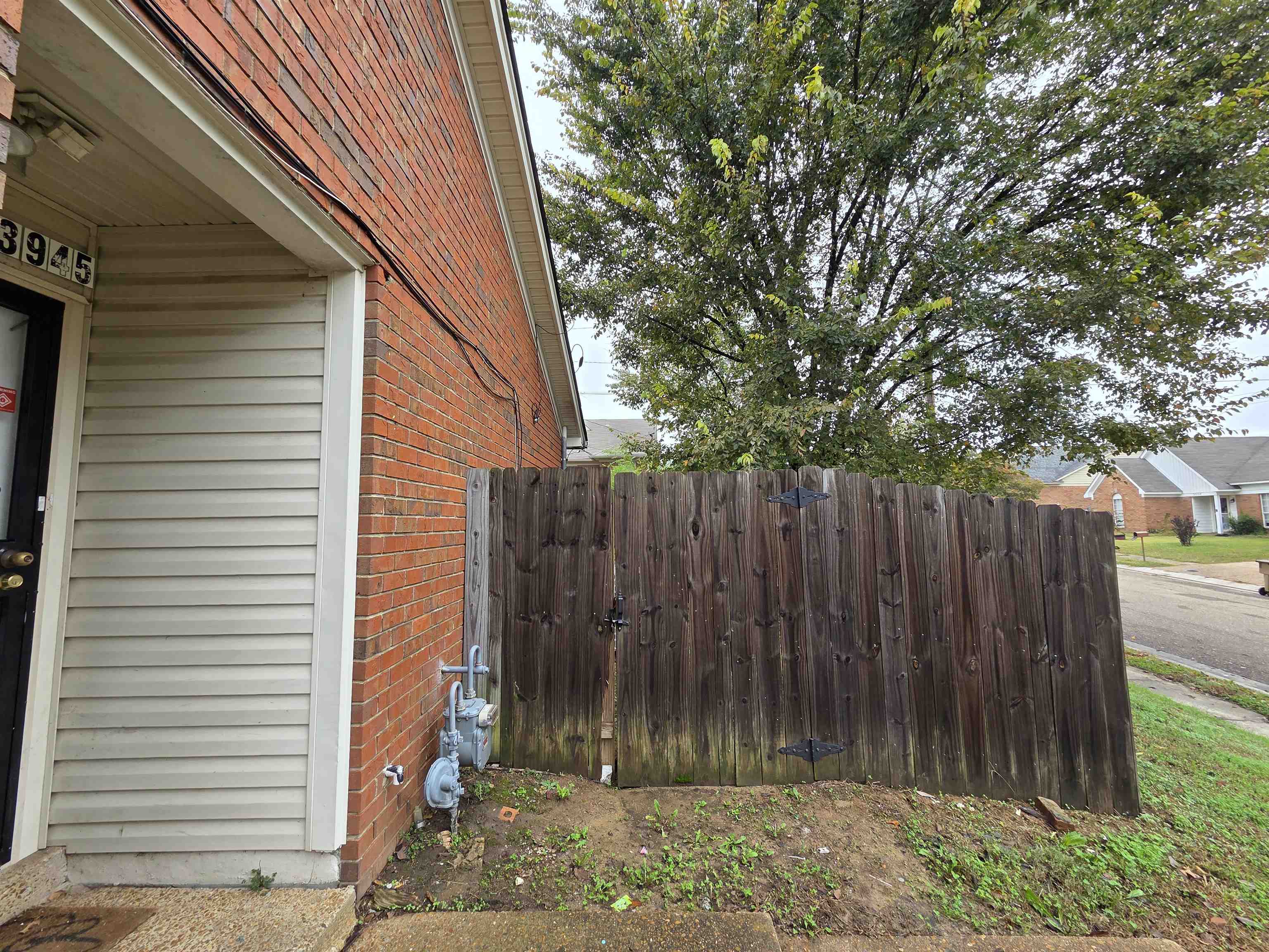 3945 Oak Branch Circle East Memphis, TN 38135 - Photo 3 of 24 a view of a backyard with wooden fence