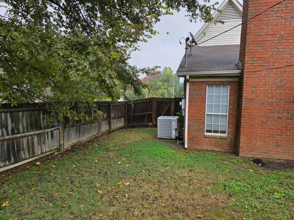 a house view with a outdoor space