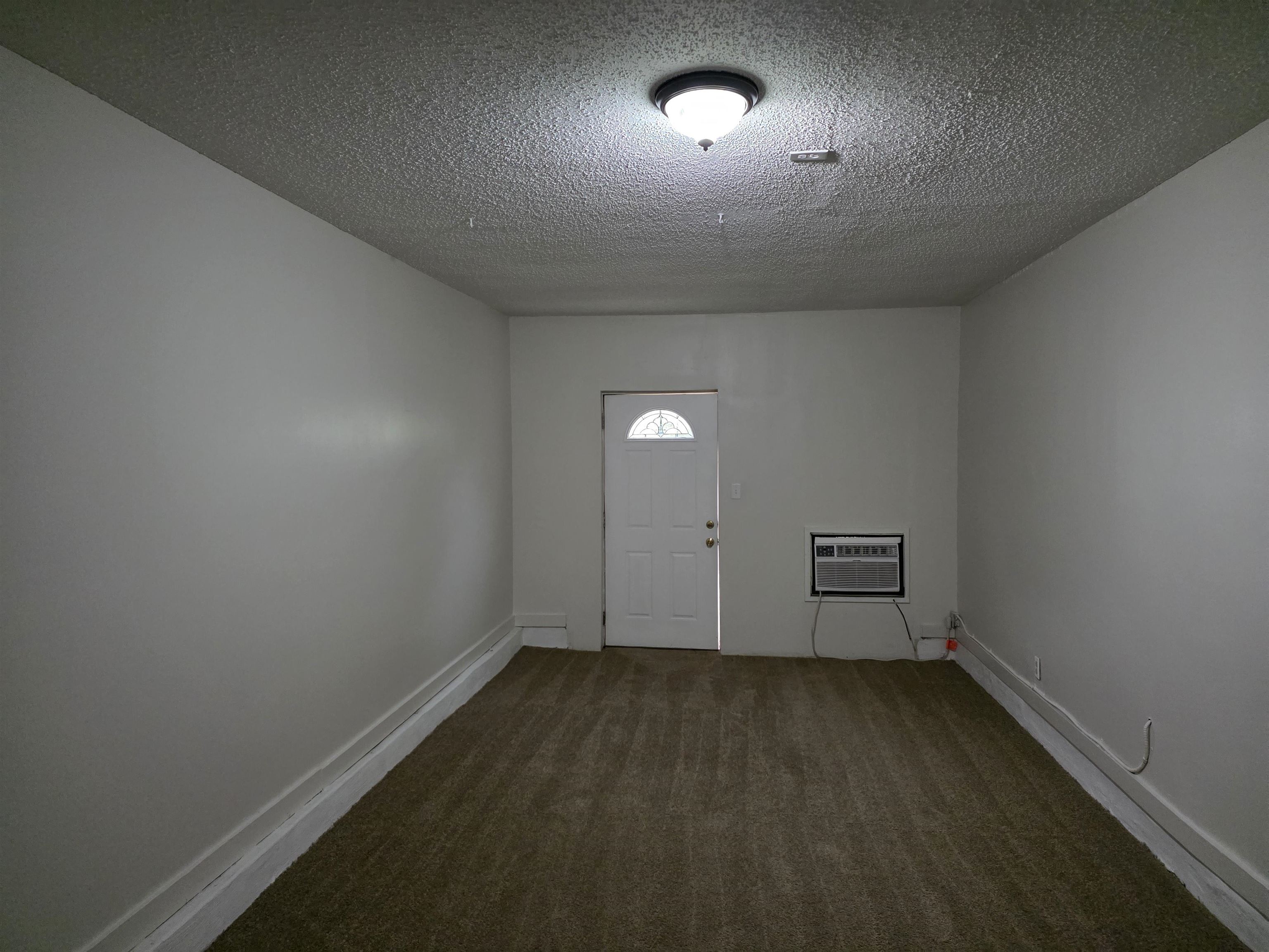 3945 Oak Branch Circle East Memphis, TN 38135 - Photo 8 of 24 an empty room with a empty space and windows