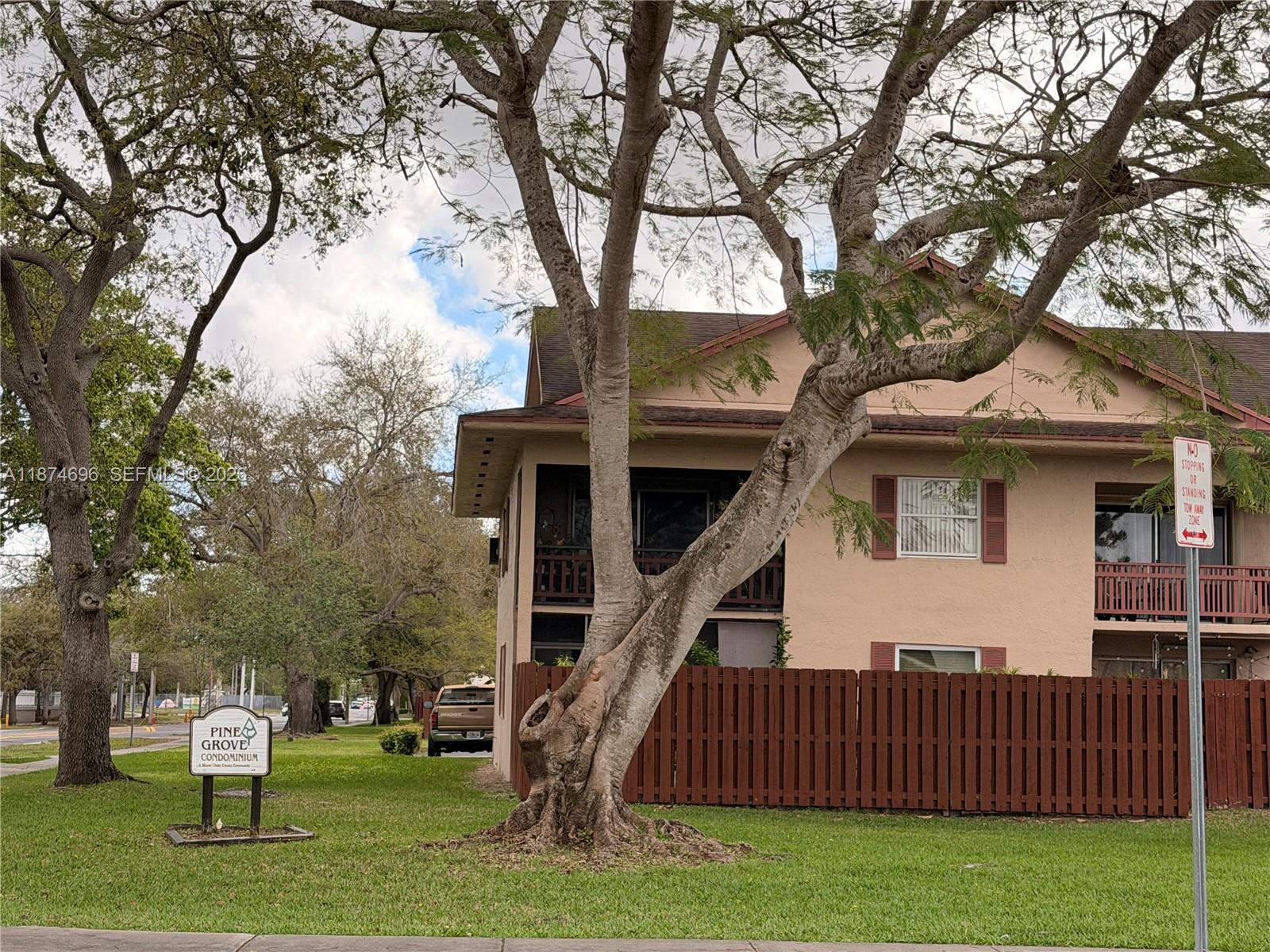 11295 Southwest 88th Street, Unit M109 Miami, FL 33176 - Photo 2 of 17 a view of a house with a yard