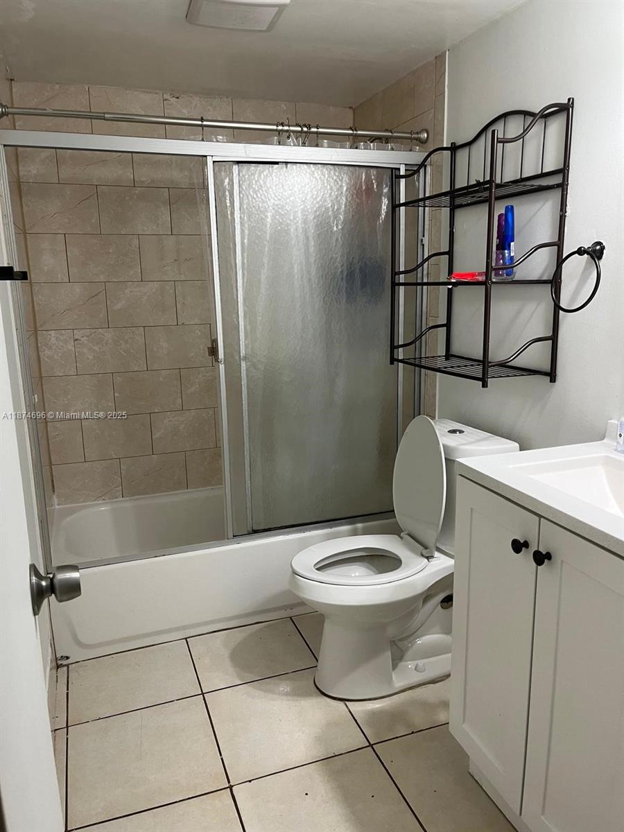 11295 Southwest 88th Street, Unit M109 Miami, FL 33176 - Photo 7 of 10 a bathroom with a toilet and a shower