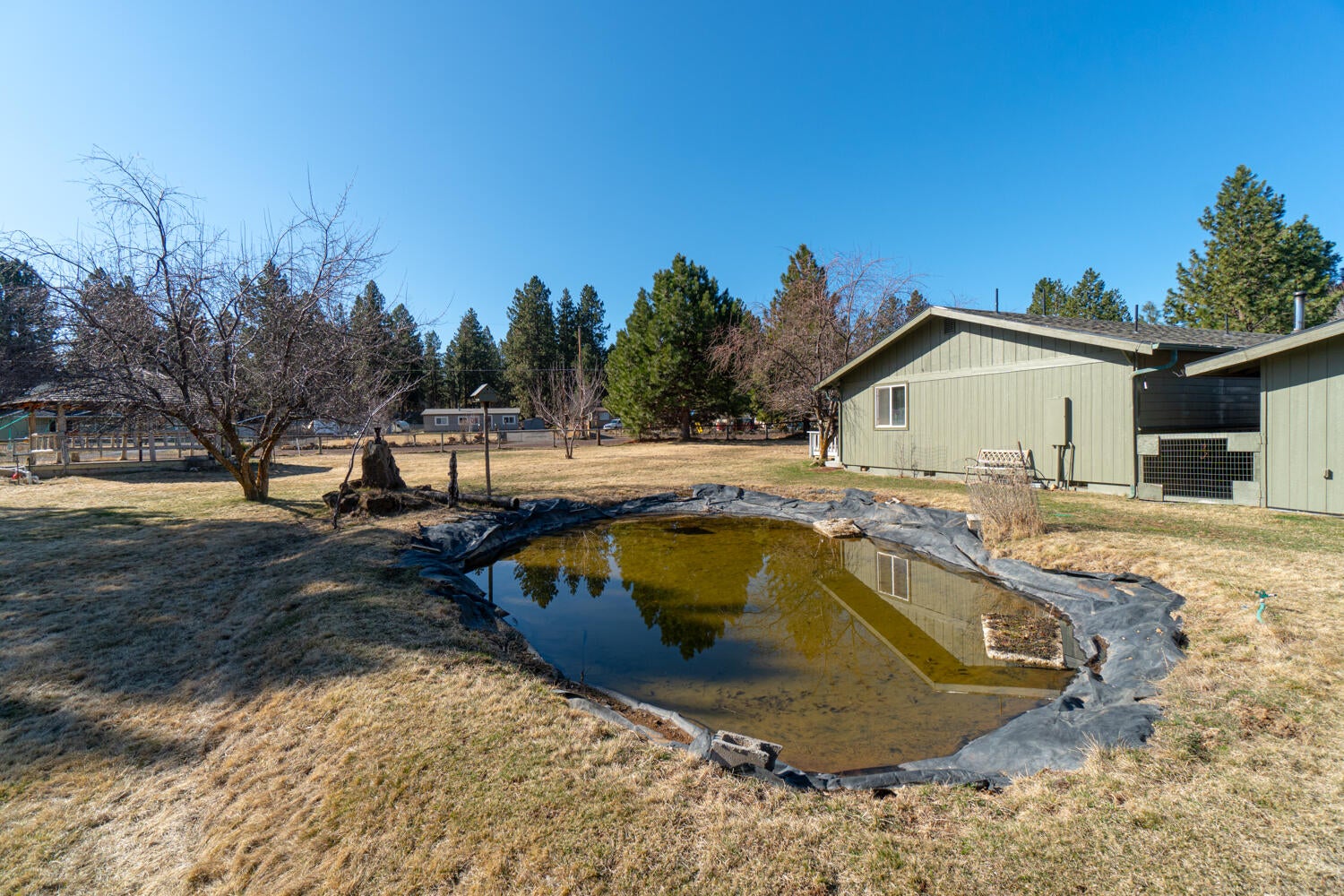 19333 Baker Road Bend, OR 97702 - Photo 28 of 49 Arnold irrigation flows from the large cistern (located under the gazebo) into the pond.