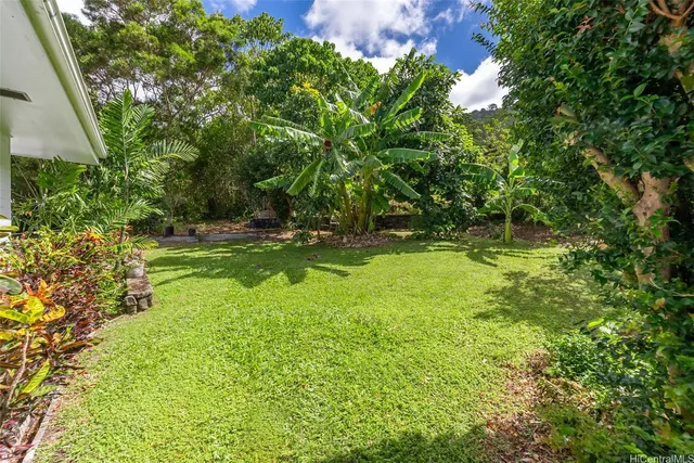 a view of backyard with green space