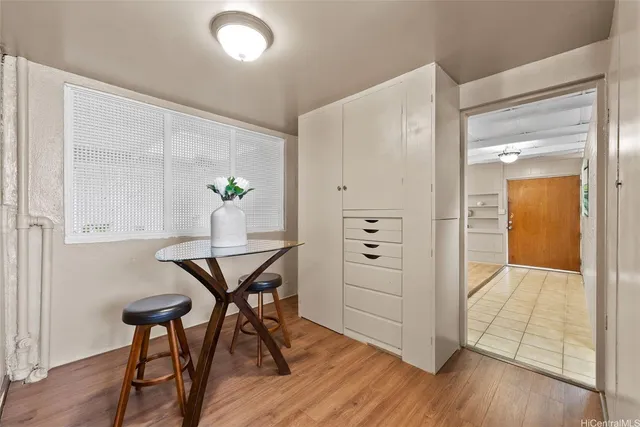 a workspace room with furniture and wooden floor