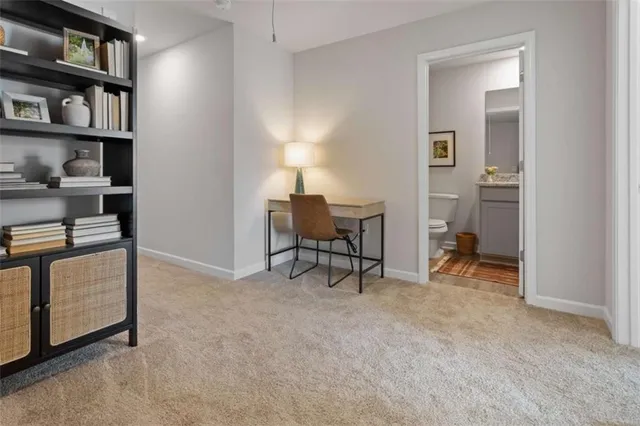 a view of room with workspace and window