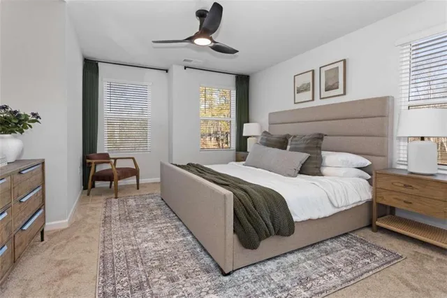 a bed room with a bed and a chair