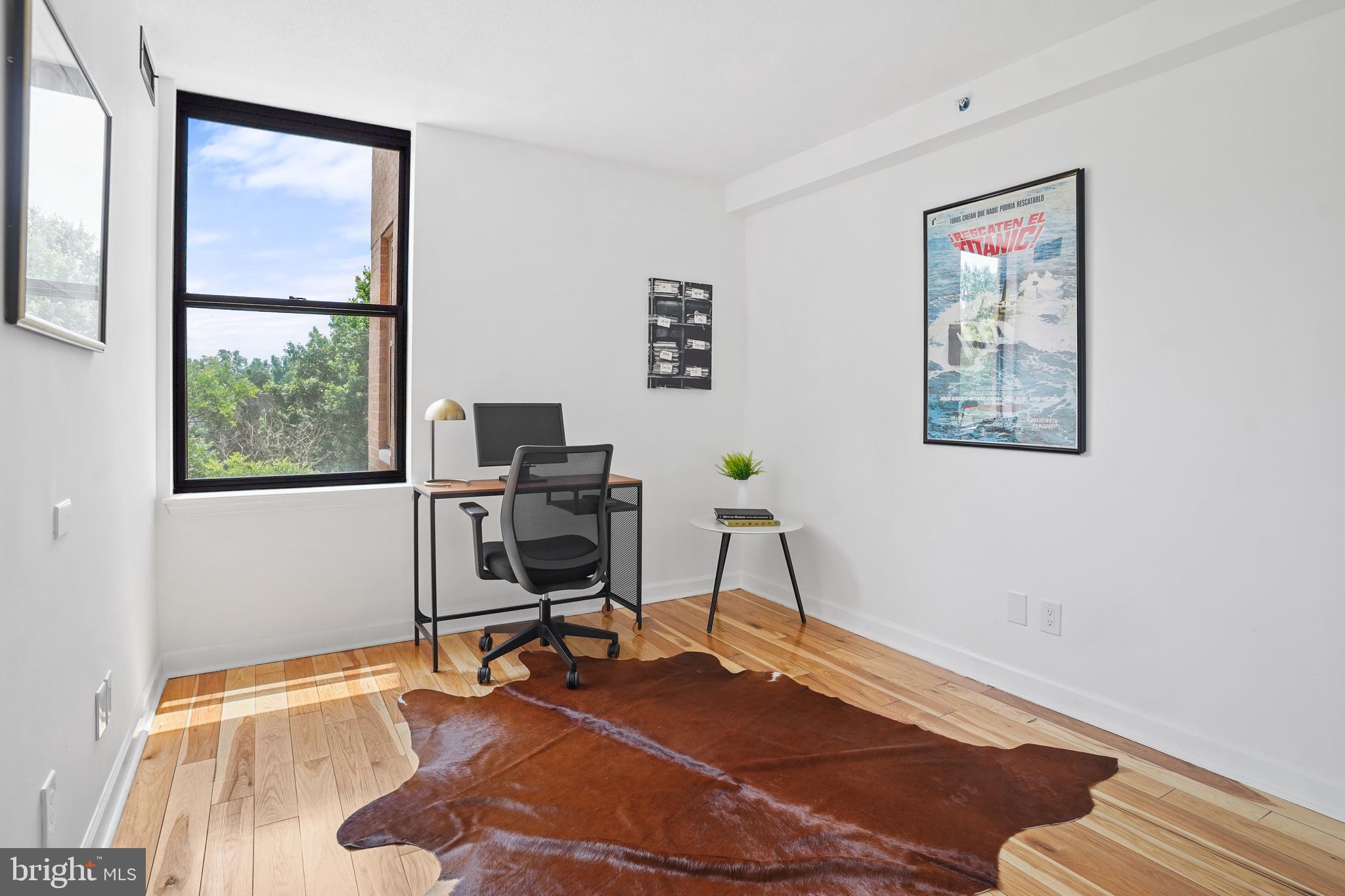 5000 Battery Lane, Unit 501 Bethesda, MD 20814 - Photo 17 of 21 a view of a workspace with furniture and a window