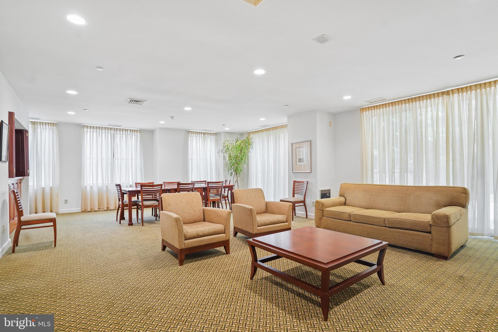 5000 Battery Lane, Unit 501 Bethesda, MD 20814 - Photo 19 of 21 a living room with furniture a rug and a table