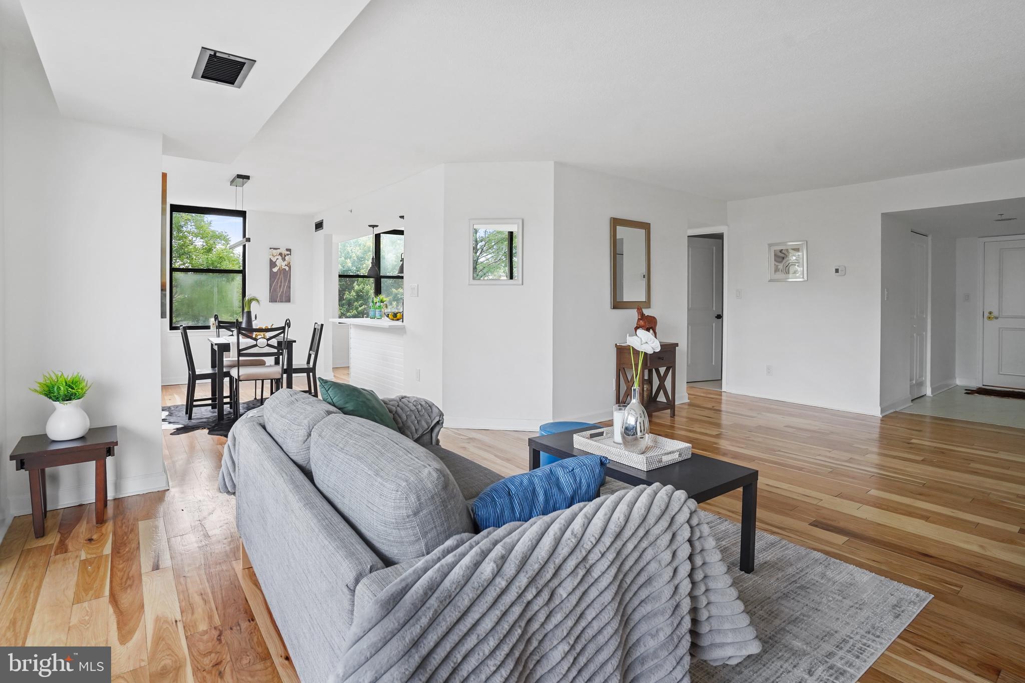 5000 Battery Lane, Unit 501 Bethesda, MD 20814 - Photo 4 of 21 a living room with furniture and wooden floor