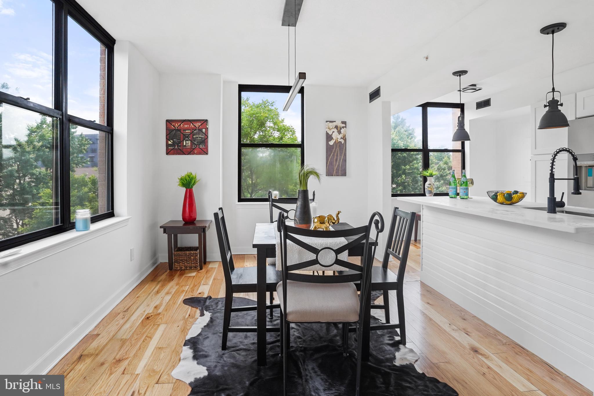 5000 Battery Lane, Unit 501 Bethesda, MD 20814 - Photo 10 of 21 a view of a dining room filled with furniture and window