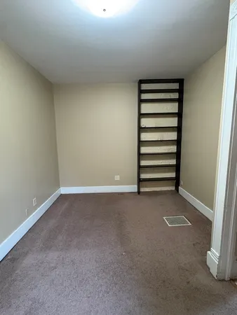 a view of a room with a white walls