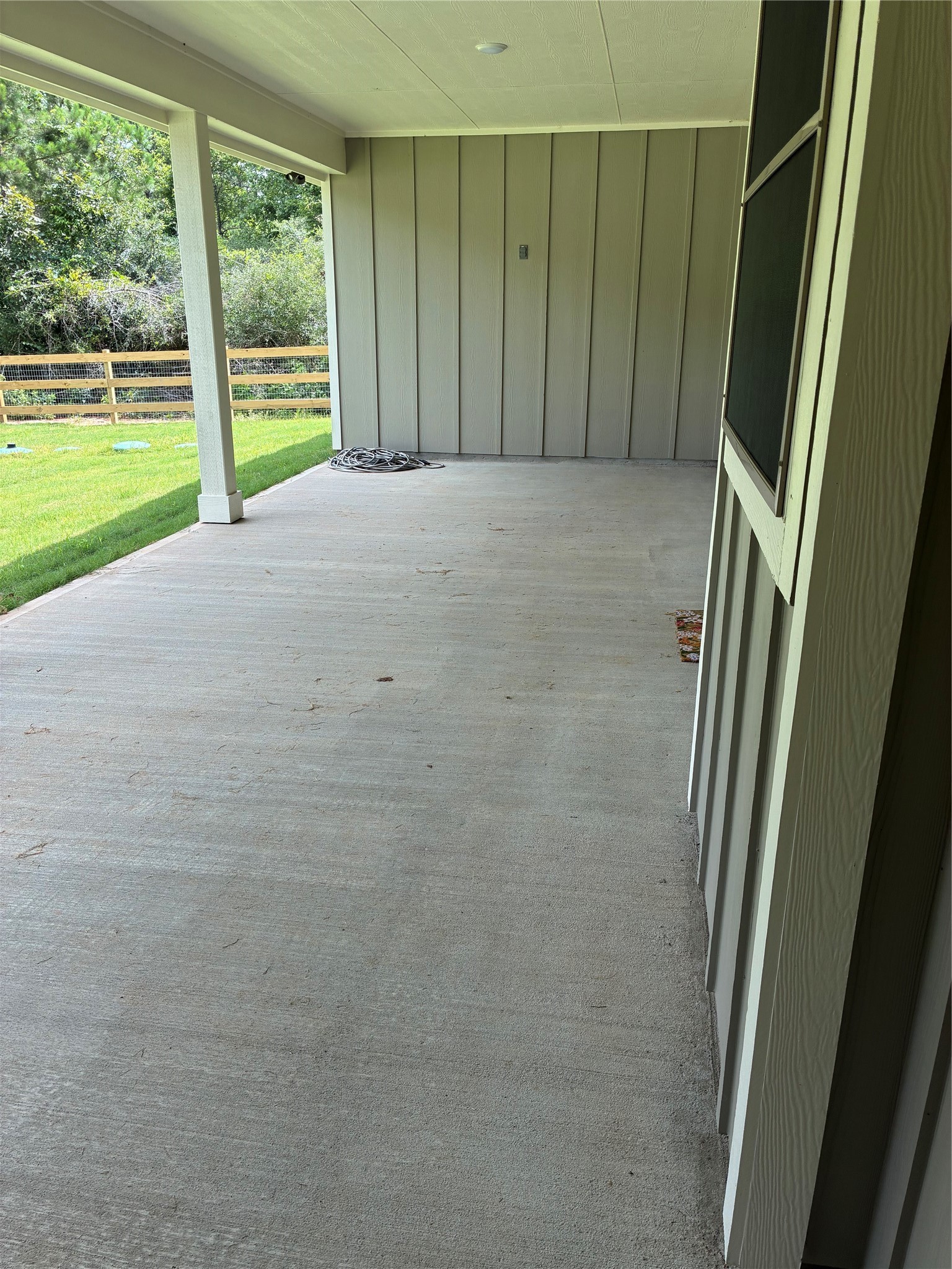 347 Iron Horse Road Willis, TX 77378 - Photo 25 of 49 View of covered patio from side door