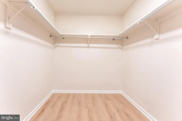 a view of an empty walk in closet