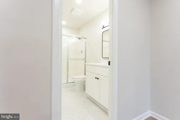 a bathroom with a granite countertop sink