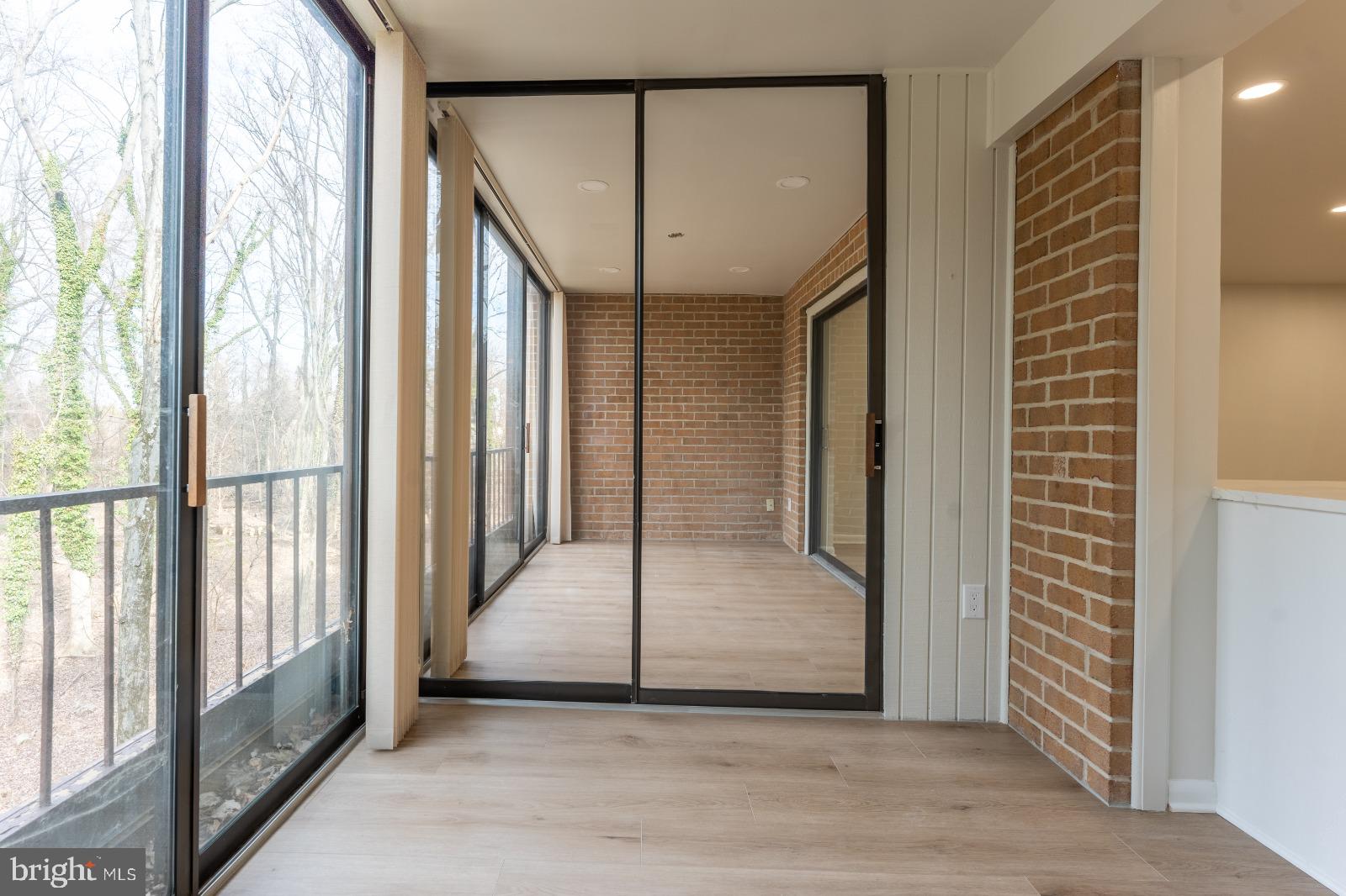 6350 Red Cedar Place, Unit 309 Baltimore, MD 21209 - Photo 29 of 29 a view of a hallway with wooden floor and staircase