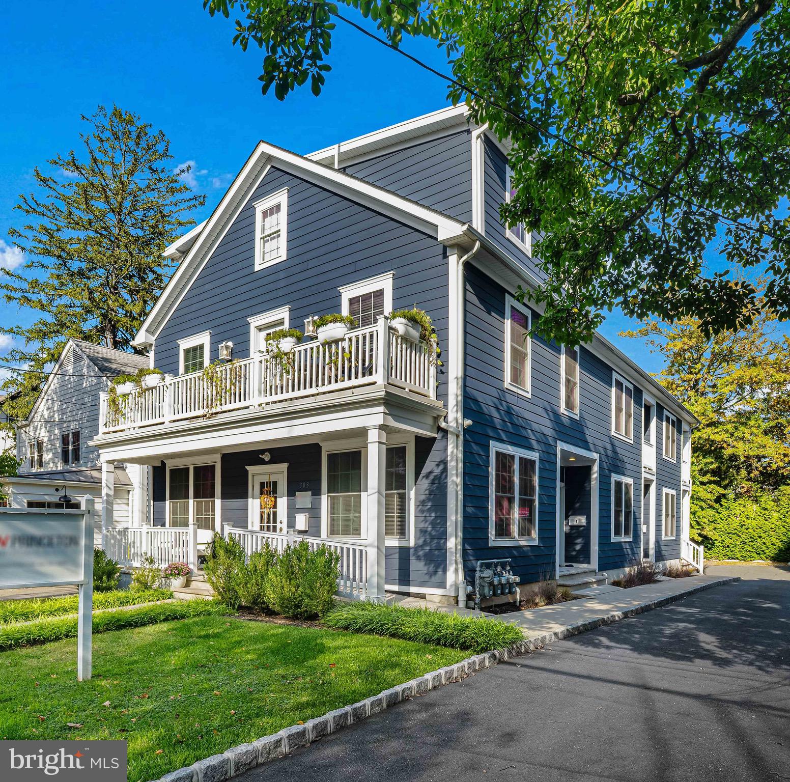 303 # 2 Witherspoon Street Princeton, NJ 08542 - Photo 1 of 31 a front view of a house with a yard